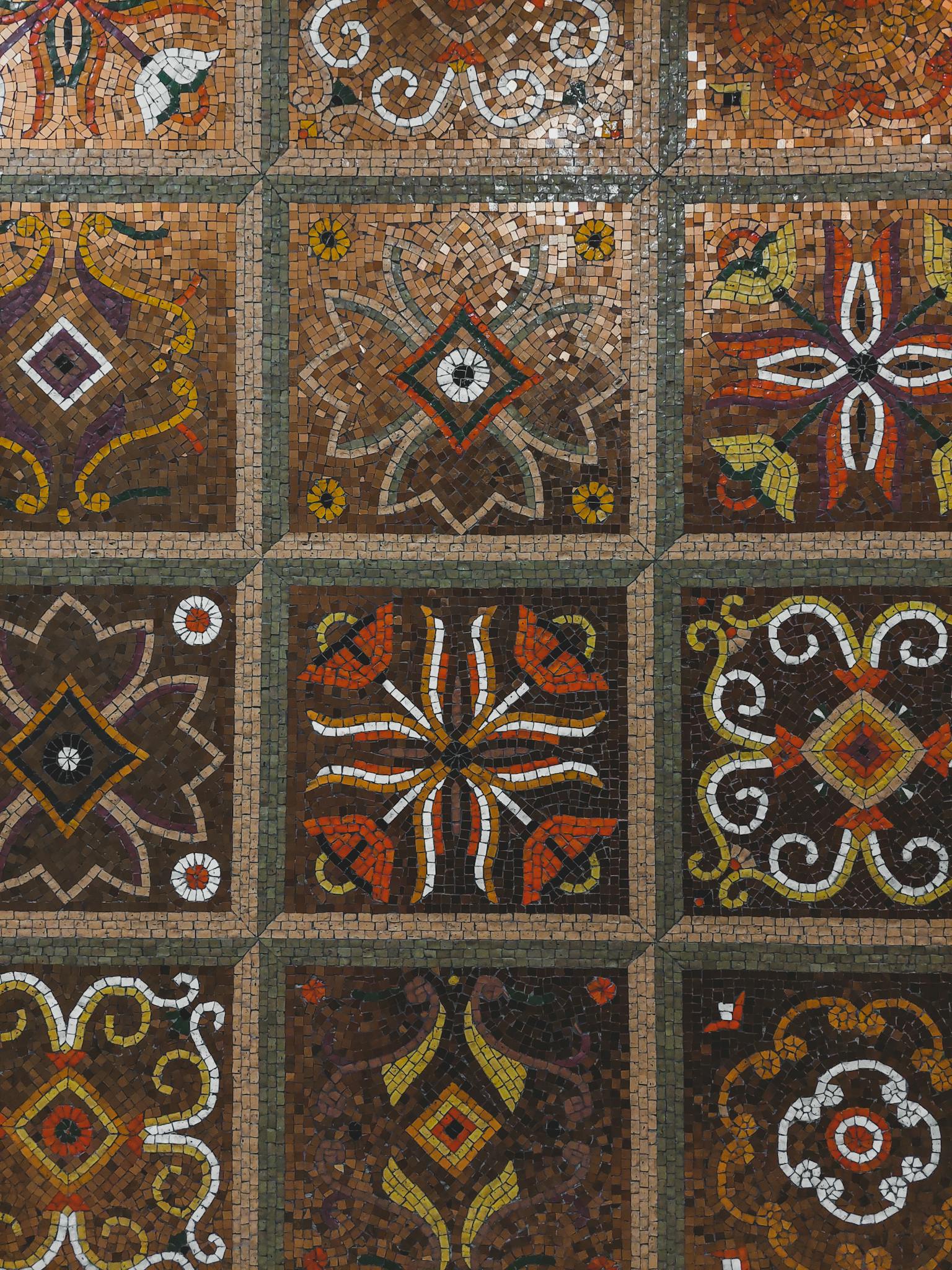 Detailed mosaic pattern with colorful geometric and floral motifs.