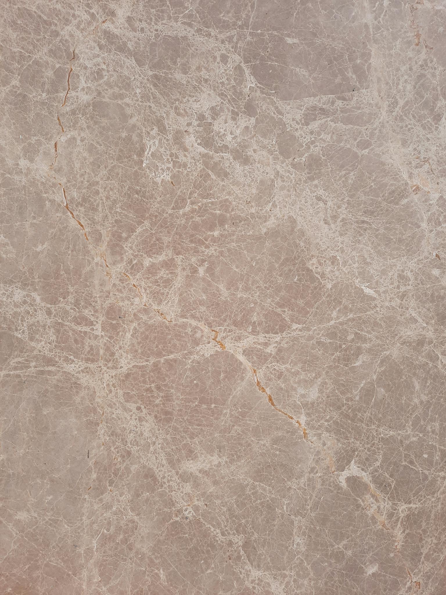 High-resolution beige marble texture perfect for backgrounds and designs.